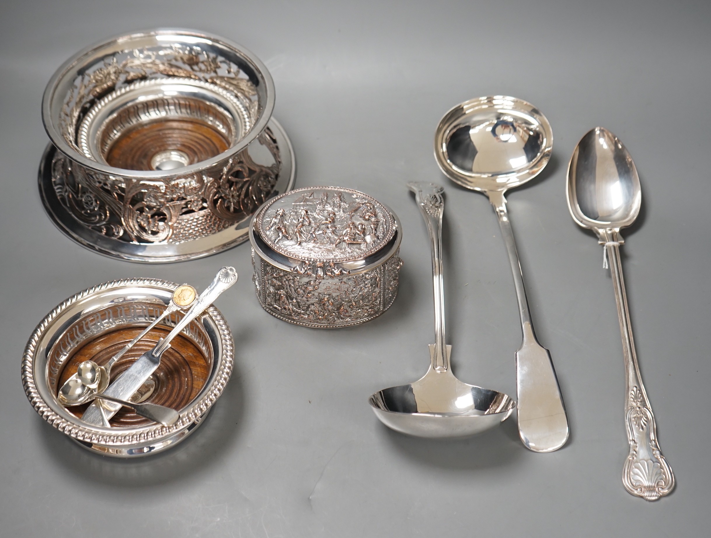 A plated dish ring, a pair of plated coasters, electrotype box, platted basting spoon and soup ladle and four spoons